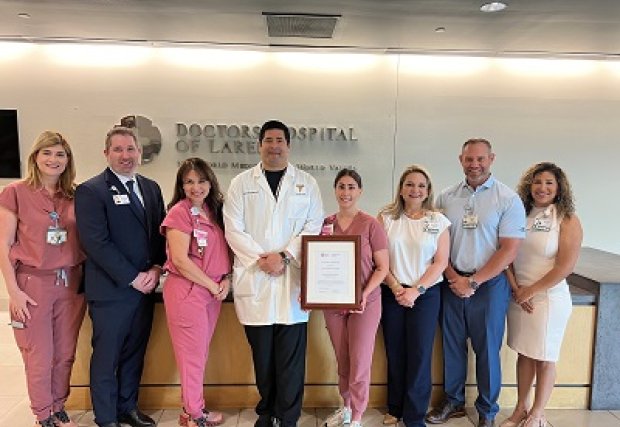 Women's services team accepting the designation plaque from the state.