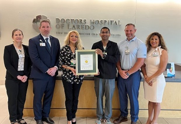 DHL employees holding The Joint Commission Stroke Certification Plaque